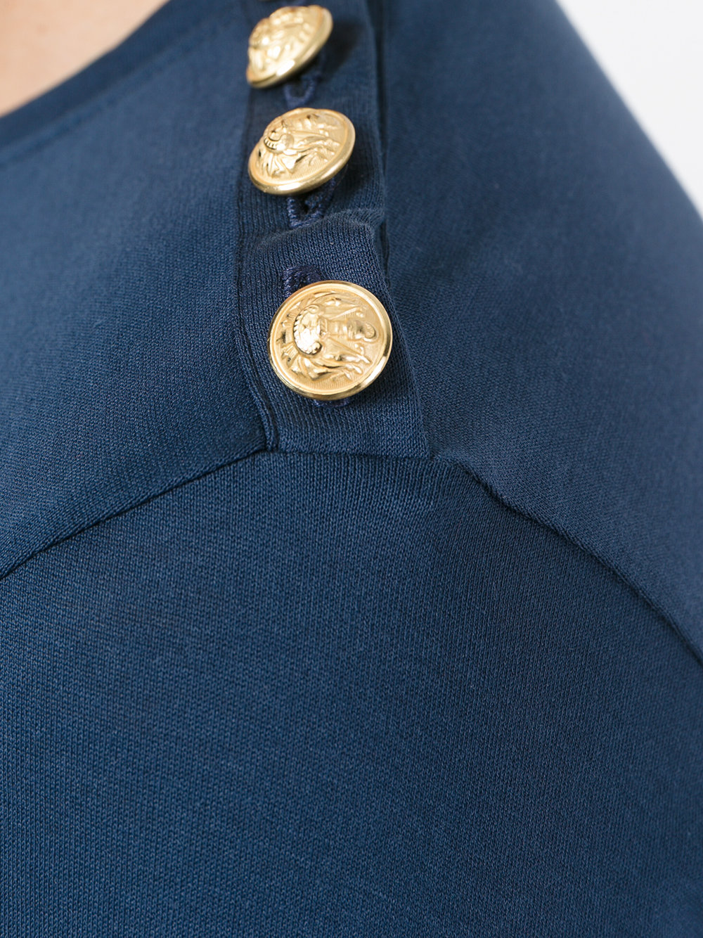 gold button logo top